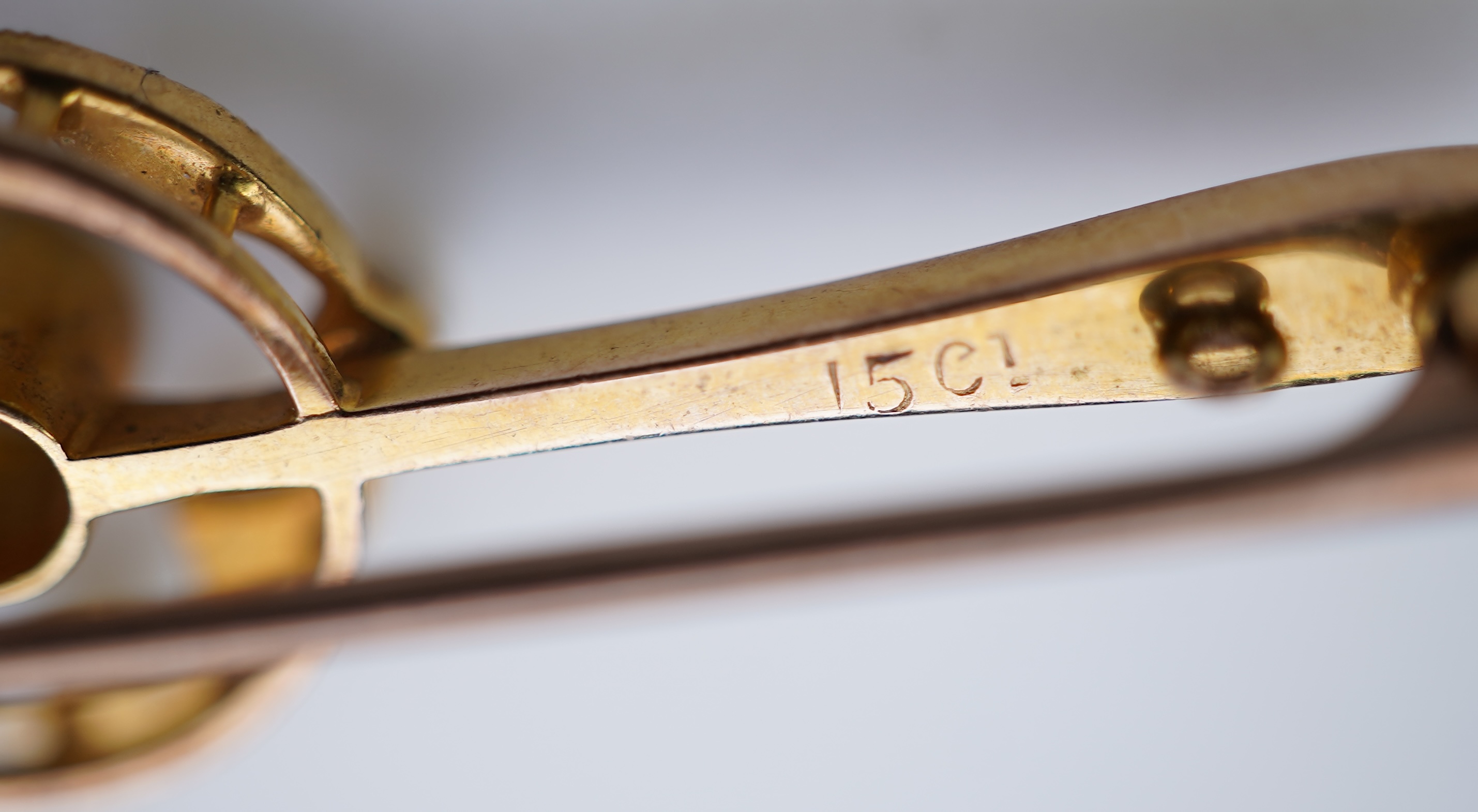 Four gold and gem-set bar brooches, early 20th century